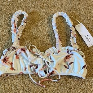 NWT bikini top. Size medium. White with floral print